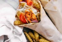 Effortless Chicken Gyros: Complete with Crispy Fries and Zesty Tzatziki