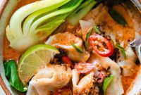 Spicy Red Curry Wonton Soup with Tender Greens