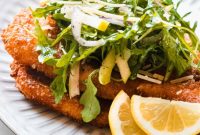 Golden-Crusted Chicken Romano Cutlets with Zesty Arugula Greens