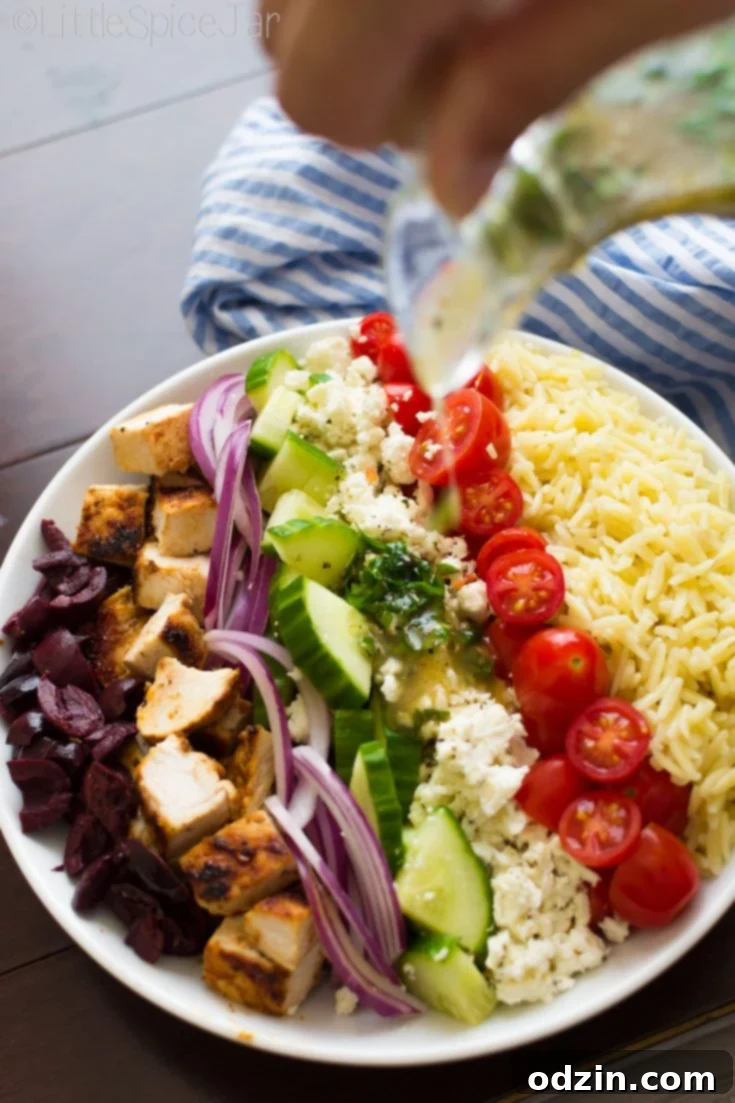 Delicious Greek Orzo Pasta Salad with grilled chicken, perfectly tossed with a vibrant dressing.