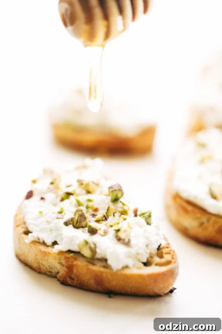 Ricotta Toasts with Pistachios and Honey - A quick and easy appetizer. The bread is warm, the ricotta is creamy, with a kiss of chopped pistachios and a drizzle of honey! #appetizers #toasts #ricottatoasts | Littlespicejar.com