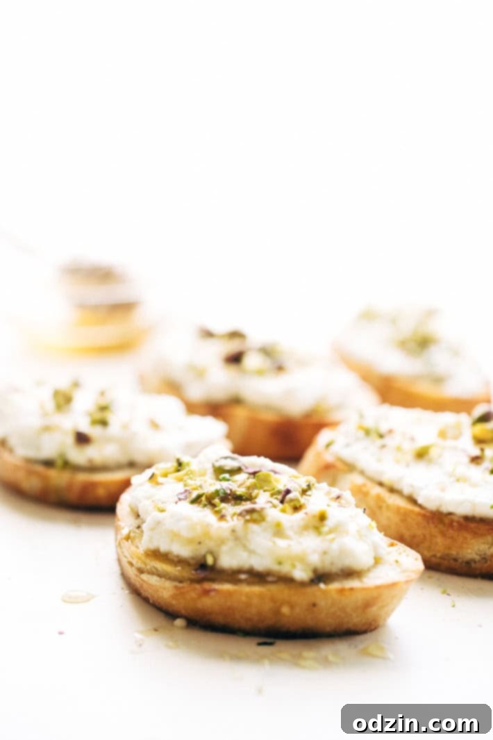 Ricotta Toasts with Pistachios and Honey - A quick and easy appetizer. The bread is warm, the ricotta is creamy, with a kiss of chopped pistachios and a drizzle of honey! #appetizers #toasts #ricottatoasts | Littlespicejar.com
