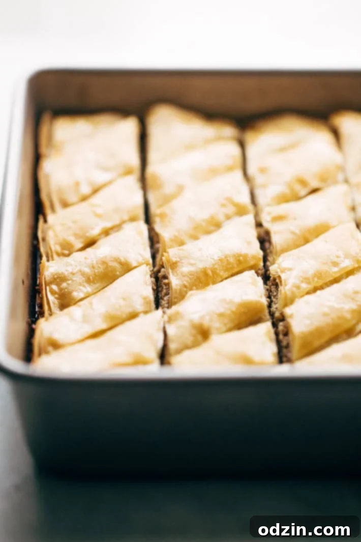 Holiday Walnut Baklava - buttery phyllo with layers of ground walnuts in between and drizzled with a homemade simple syrup with sweet orange blossom and rose water! So good! #baklava #walnutbaklava #lebanesebaklava | Littlespicejar.com