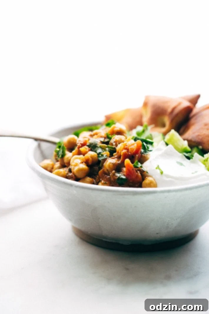 Weeknight Chana Masala Rice Bowls - A quick weeknight take on the traditional Chana Masala! Serve over basmati rice and it's the perfect warm and cozy winter meal! #chanamasala #indianfood #chana #vegan | Littlespicejar.com