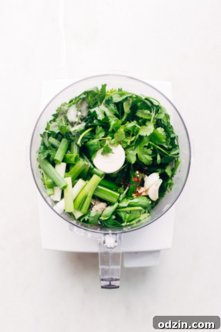 Super Easy Baked Salmon in Foil with Chimichurri Sauce - An easy recipe that takes less than 30 minute to make and is perfect for using on salads or serving with roasted veggies! #bakedsalmon #salmoninfoil #chimichurrisalmon | Littlespicejar.com