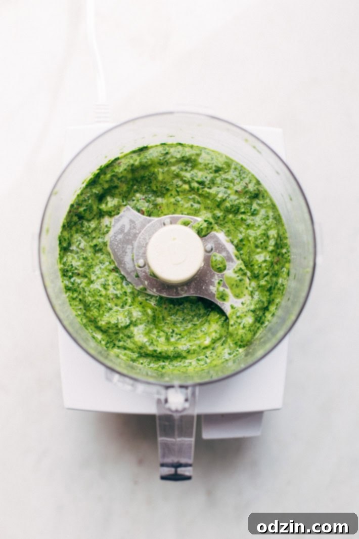 Super Easy Baked Salmon in Foil with Chimichurri Sauce - An easy recipe that takes less than 30 minute to make and is perfect for using on salads or serving with roasted veggies! #bakedsalmon #salmoninfoil #chimichurrisalmon | Littlespicejar.com