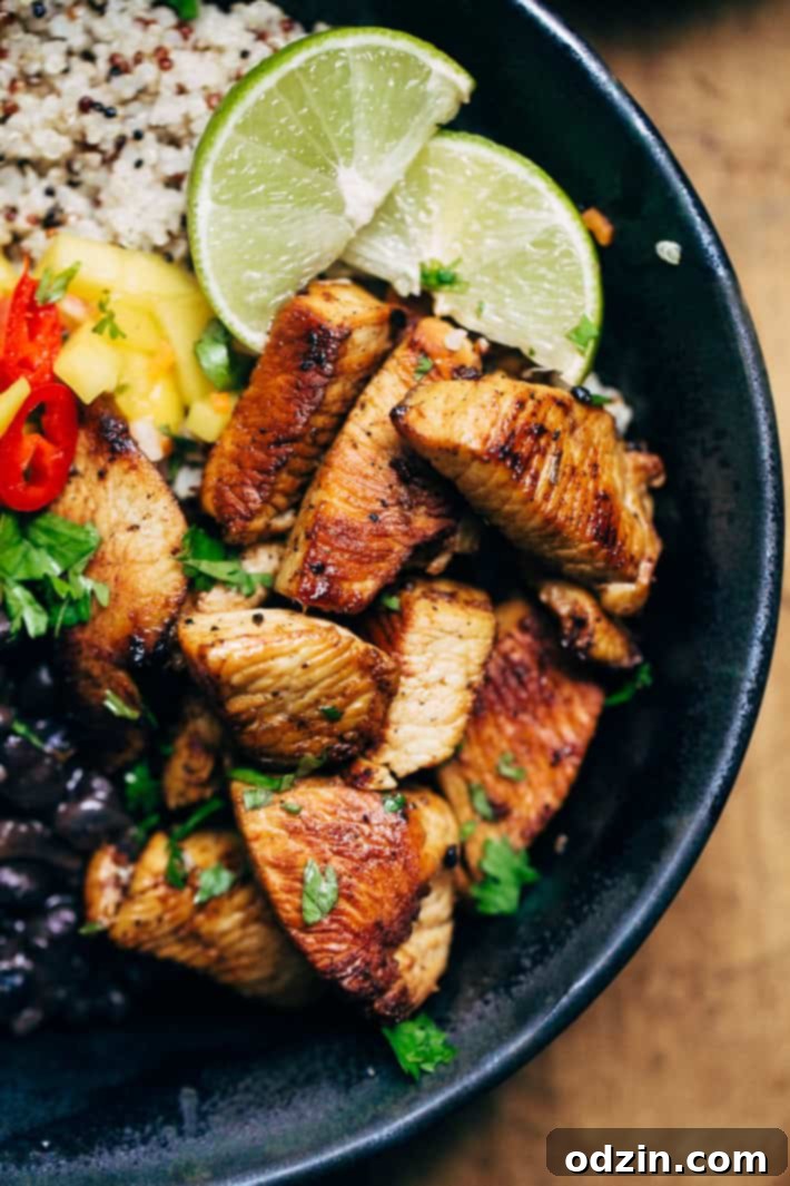 Tropical Mojo Chicken Quinoa Bowls with Mango Salsa and Black Beans 7 Freshly chopped mango salsa ingredients in a bowl