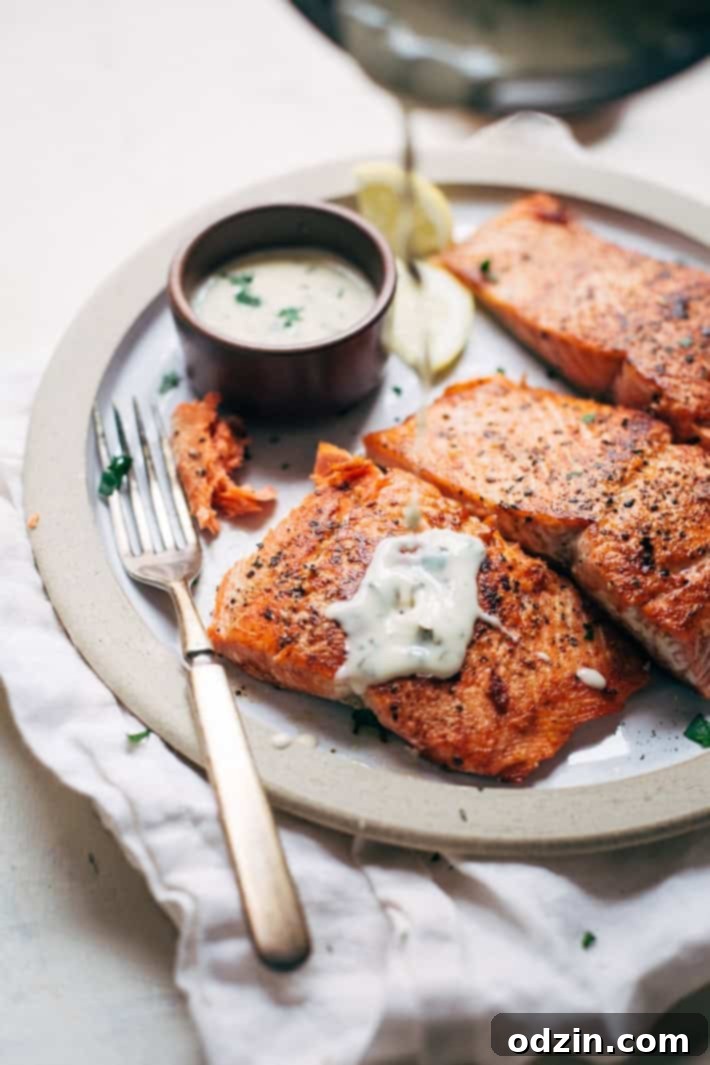 Close-up of the smooth, rich lemon butter cream sauce simmering in a saucepan.