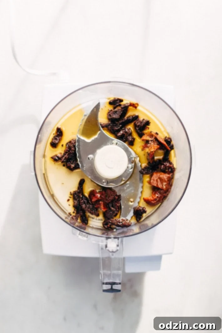 Close-up of fresh Mediterranean Couscous Salad ingredients, including walnuts and artichokes