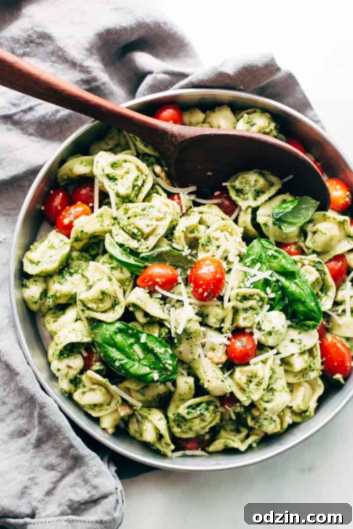 Quick 15-Minute Spinach Pesto Tortellini Salad with Fresh Ingredients - Ideal for Picnics and Potlucks