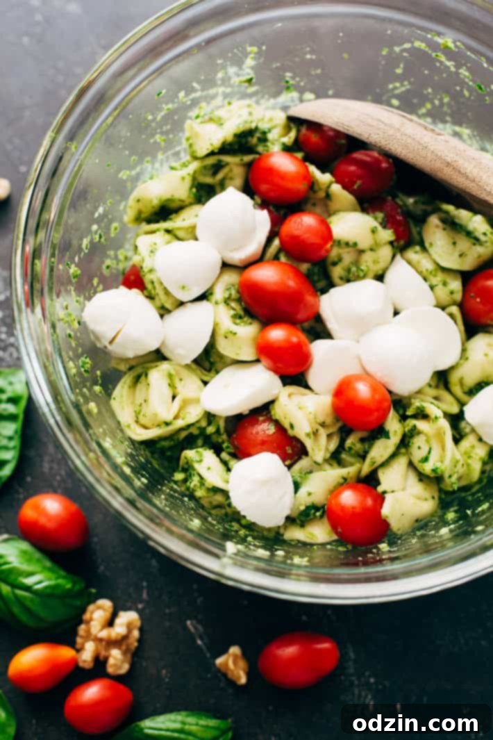 Delicious 15-Minute Spinach Pesto Tortellini Salad with Mozzarella and Tomatoes