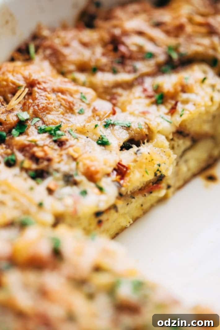 Portion of Sun-dried Tomato Basil Breakfast Casserole on a plate, highlighting the delicious layers.