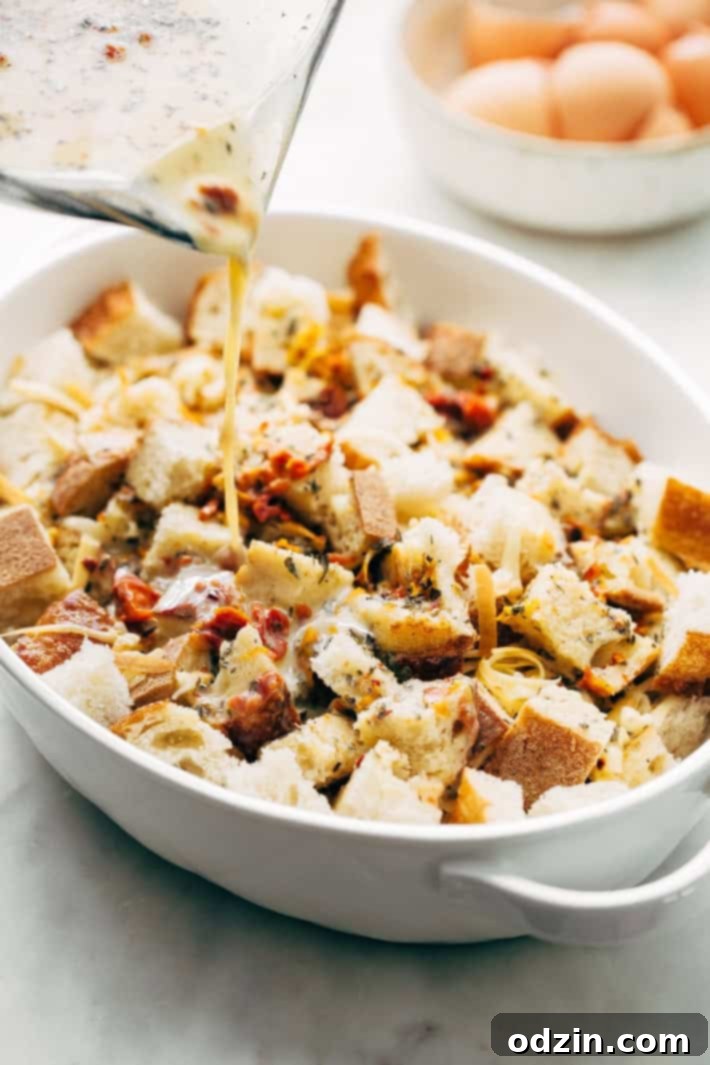 The assembled Sun-dried Tomato Basil Breakfast Casserole, covered and ready for refrigeration.