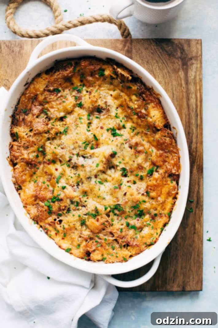 A slice of Sun-dried Tomato Basil Breakfast Casserole, garnished with fresh basil.