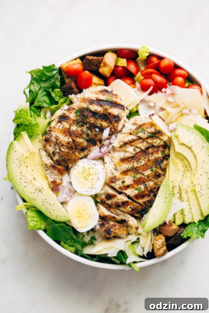 Overhead view of a vibrant Grilled Romaine Chicken Caesar Cobb Salad
