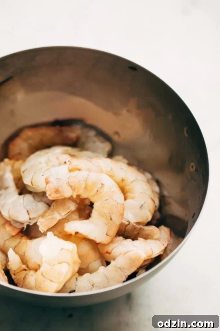 Spicy Shrimp Masala Ingredient Prep Ingredients laid out for 30-Minute Spicy Shrimp Masala preparation, including fresh tomatoes, ginger, garlic, and aromatic Indian spices.