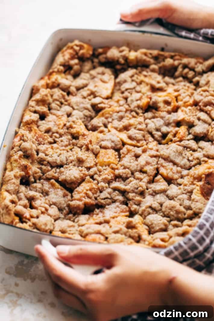 Apple French Toast Casserole topped with streusel and icing