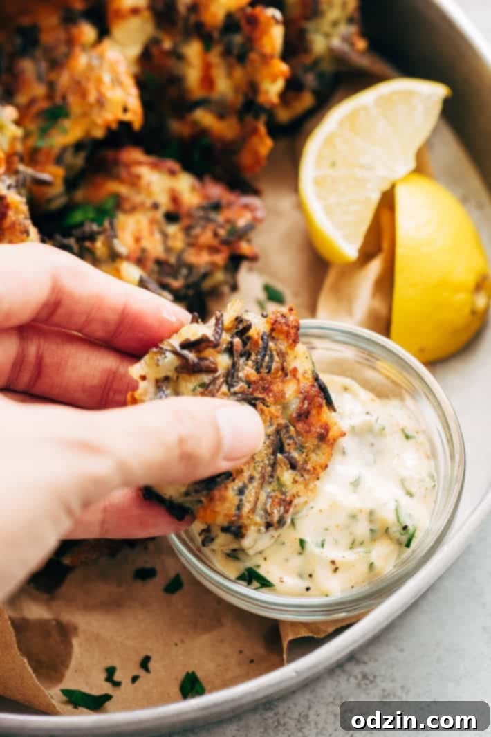 Golden Wild Rice Chicken Fritters with Creamy Garlic Herb Dip 8 Finished Cheesy Wild Rice Chicken Fritters served with dipping sauce