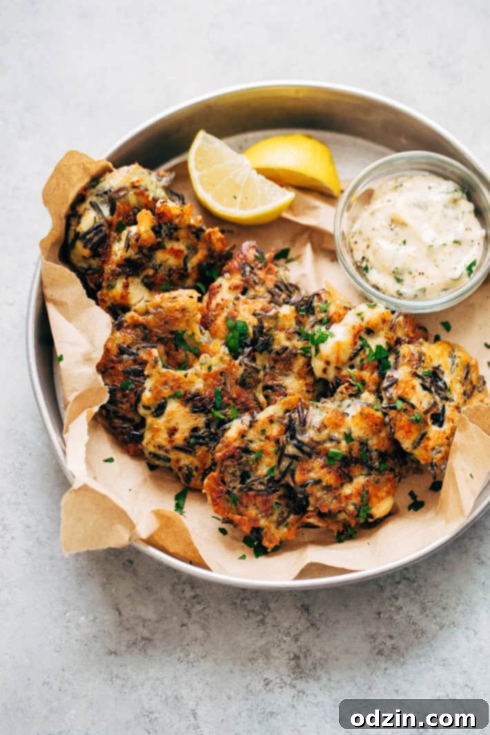 Cheesy Wild Rice Chicken Fritters with Garlic Herb Sauce