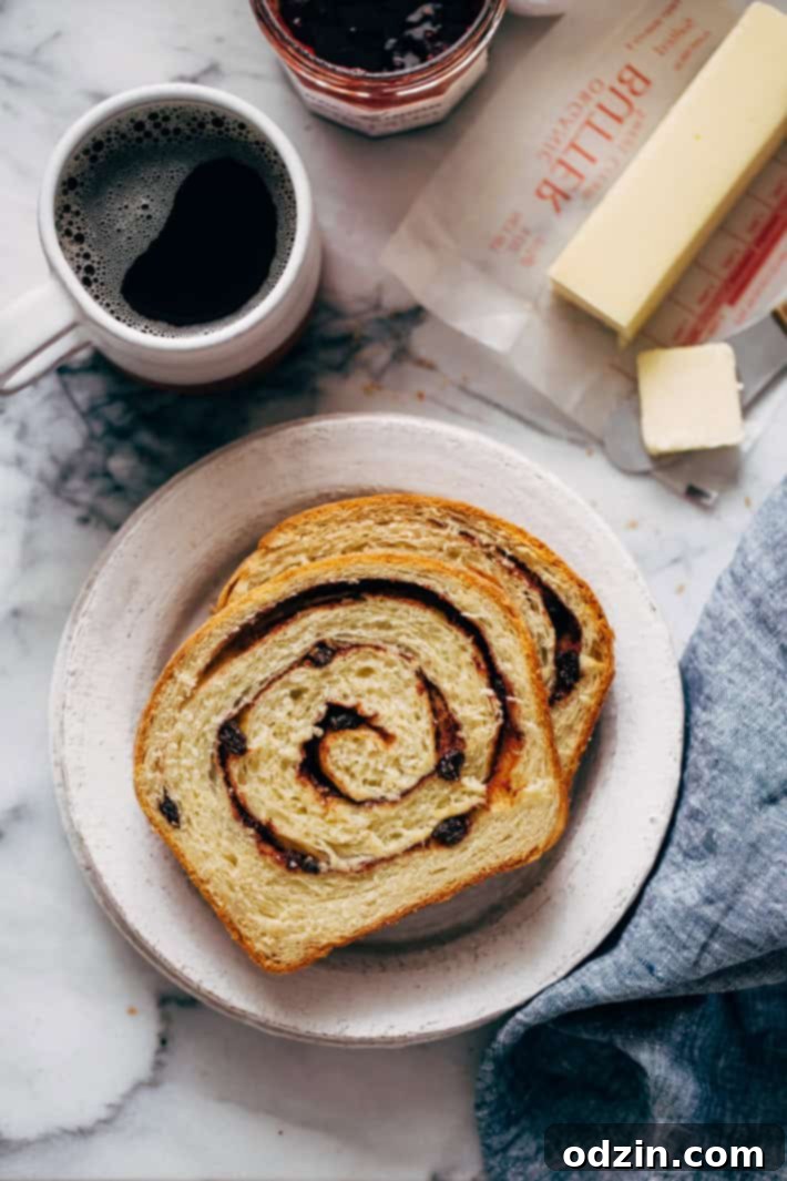 Homemade Cinnamon Swirl Bread - swirls of cinnamon sugar and raisins (or chocolate chips). Perfect to serve smeared with butter or to turn into french toast! #cinnamonbread #cinnamonswirlbread #swirlbread #cinnamonsugarbread | Littlespicejar.com