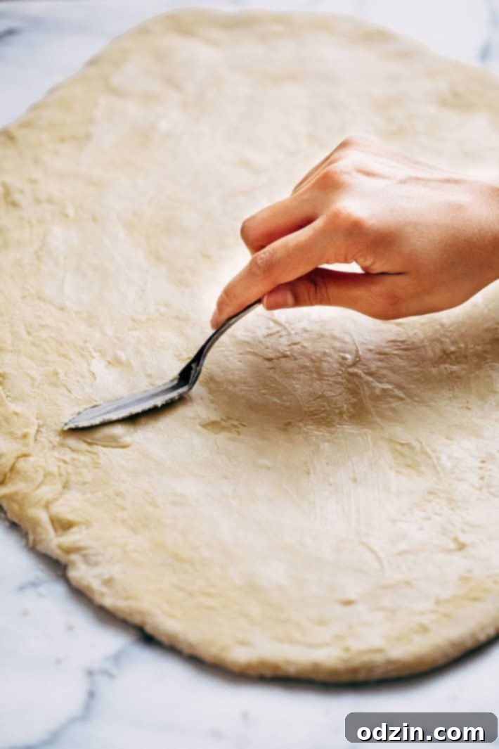 Homemade Cinnamon Swirl Bread - swirls of cinnamon sugar and raisins (or chocolate chips). Perfect to serve smeared with butter or to turn into french toast! #cinnamonbread #cinnamonswirlbread #swirlbread #cinnamonsugarbread | Littlespicejar.com