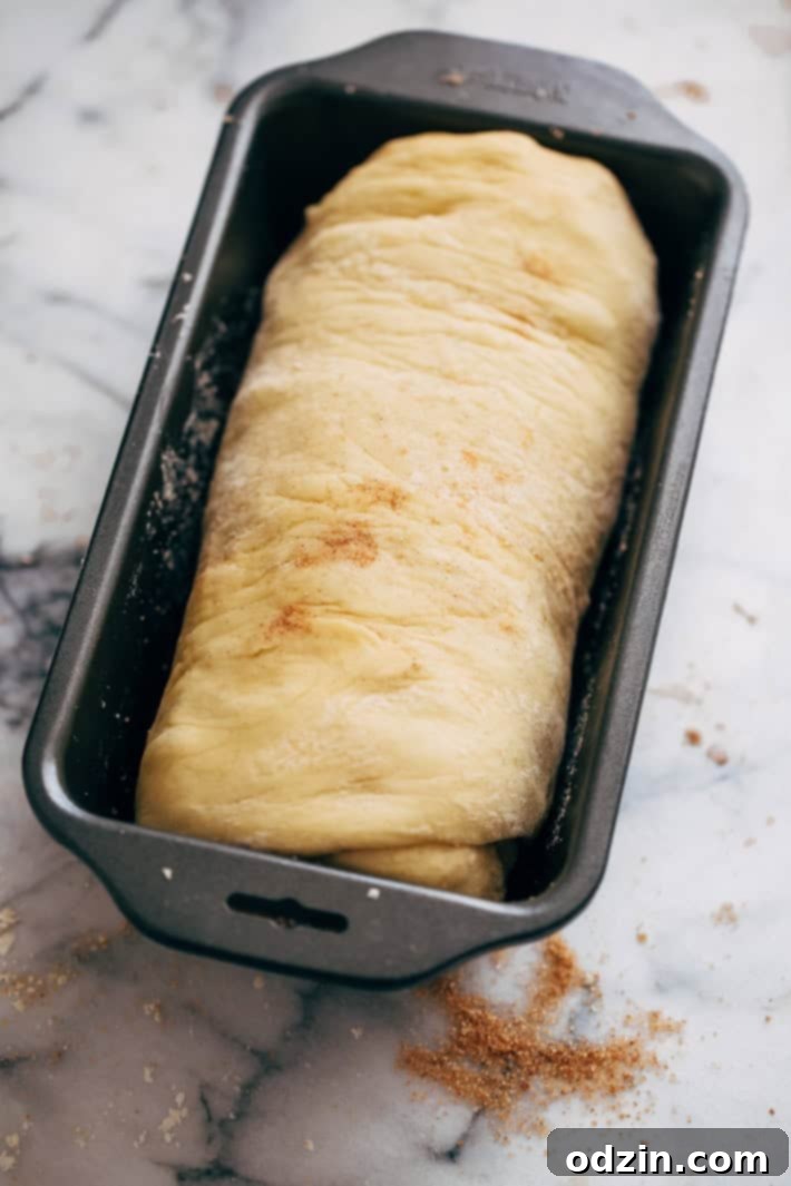 Homemade Cinnamon Swirl Bread - swirls of cinnamon sugar and raisins (or chocolate chips). Perfect to serve smeared with butter or to turn into french toast! #cinnamonbread #cinnamonswirlbread #swirlbread #cinnamonsugarbread | Littlespicejar.com