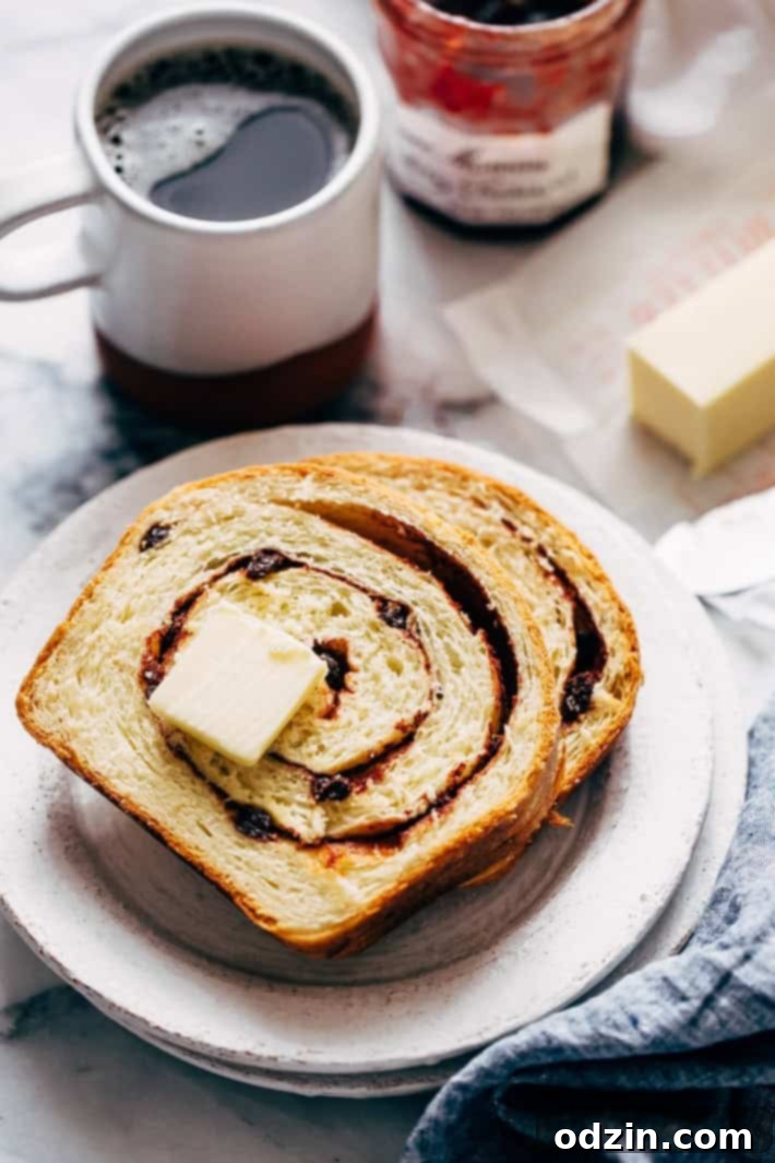 Homemade Cinnamon Swirl Bread - swirls of cinnamon sugar and raisins (or chocolate chips). Perfect to serve smeared with butter or to turn into french toast! #cinnamonbread #cinnamonswirlbread #swirlbread #cinnamonsugarbread | Littlespicejar.com