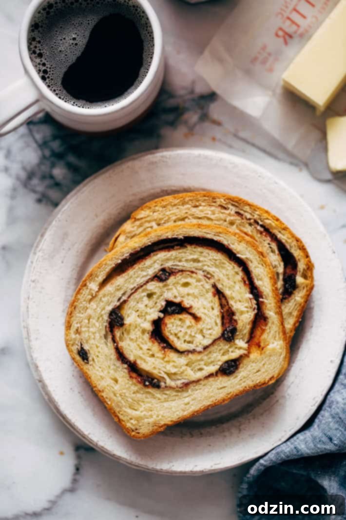 Homemade Cinnamon Swirl Bread - swirls of cinnamon sugar and raisins (or chocolate chips). Perfect to serve smeared with butter or to turn into french toast! #cinnamonbread #cinnamonswirlbread #swirlbread #cinnamonsugarbread | Littlespicejar.com