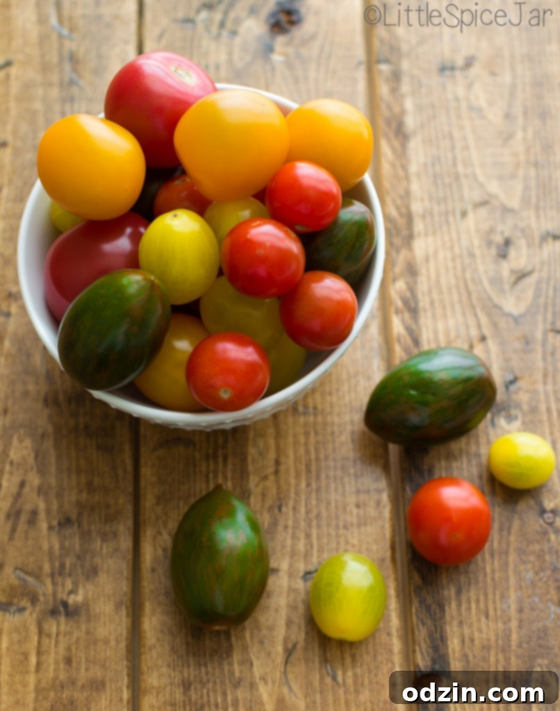 Fiery Caprese Pasta Bake 4 Spicy Baked Caprese Pasta being scooped from a baking dish