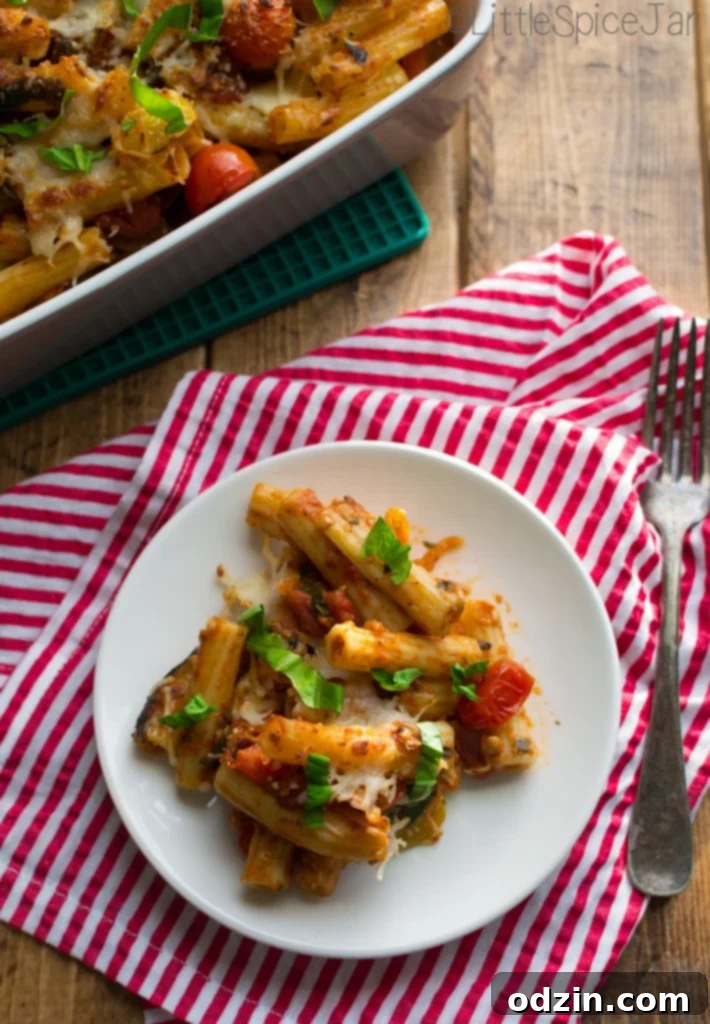 Fiery Caprese Pasta Bake 5 Baked Caprese Pasta with fresh basil garnish