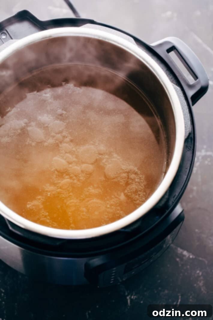 Instant Pot Chicken Pho Noodle Soup (Pho Ga) - Learn how to make chicken pho in your instant pot! This soup has tons of aromatics and is delicious! #instantpot #pressurecooker #chickenpho #phoga #instantpotchickenpho | Littlespicejar.com