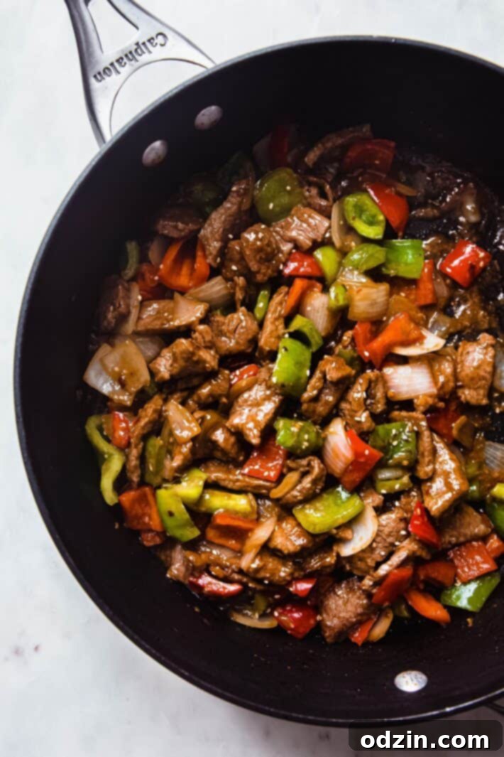 pepper steak in black saute pan