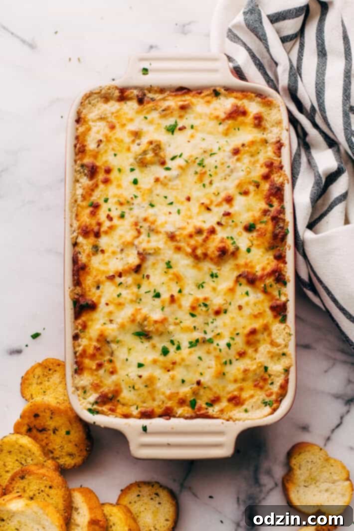 Gooey Philly Cheese Steak Dip Close-up of the gooey cheese layer on a baked Philly Cheese Steak Dip
