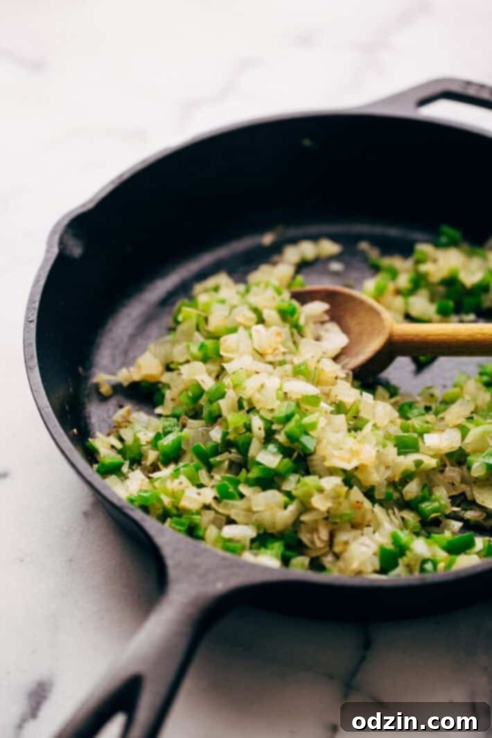 Mixing Philly Cheese Steak Dip Mixing bowl with cream cheese and other ingredients for the dip