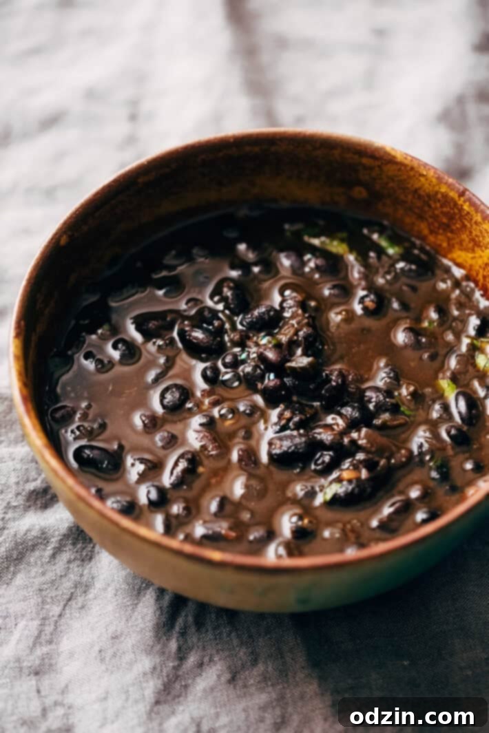 Instant Pot Easy Detoxing Black Bean Soup - a super simple homemade soup made in the pressure cooker! Great for bagged lunches because it's better as it sits! #spicyblackbeansoup #blackbeansoup #detoxsoup #detoxingsoup | Littlespicejar.com Instant Pot Easy Detoxing Black Bean Soup - a super simple homemade soup made in the pressure cooker! Great for bagged lunches because it's better as it sits! #spicyblackbeansoup #blackbeansoup #detoxsoup #detoxingsoup | Littlespicejar.com