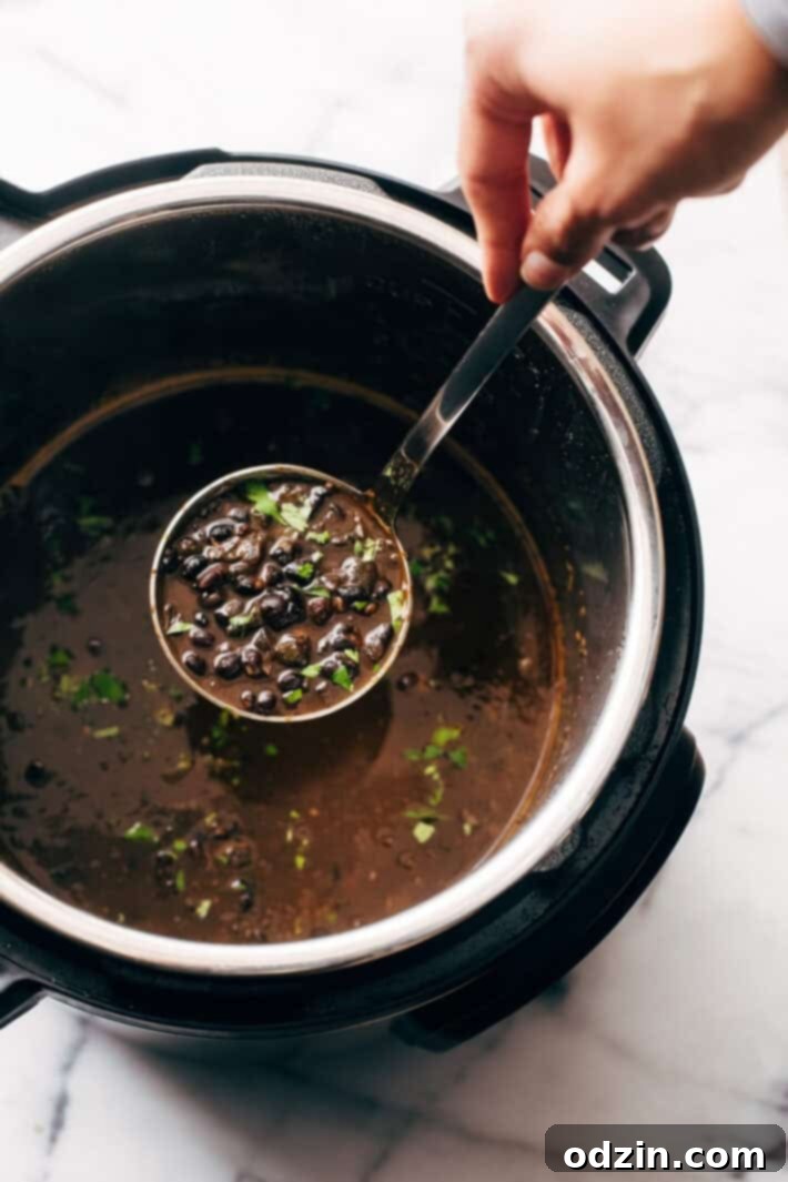 Instant Pot Easy Detoxing Black Bean Soup - a super simple homemade soup made in the pressure cooker! Great for bagged lunches because it's better as it sits! #spicyblackbeansoup #blackbeansoup #detoxsoup #detoxingsoup | Littlespicejar.com Instant Pot Easy Detoxing Black Bean Soup - a super simple homemade soup made in the pressure cooker! Great for bagged lunches because it's better as it sits! #spicyblackbeansoup #blackbeansoup #detoxsoup #detoxingsoup | Littlespicejar.com