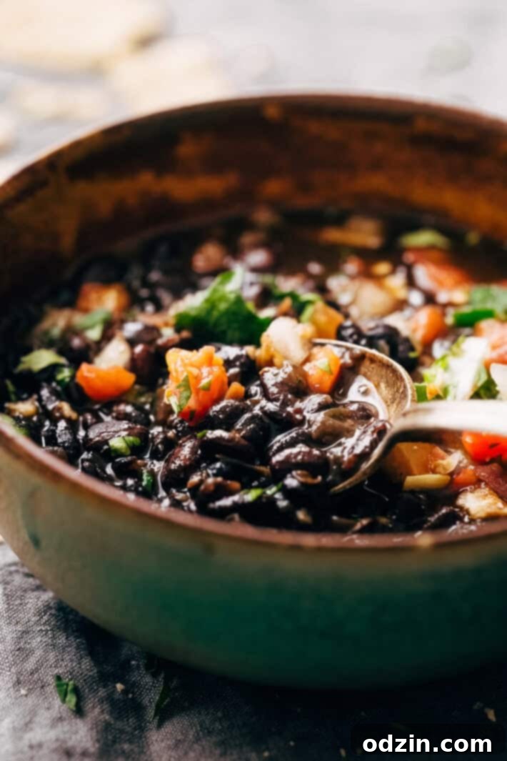 Instant Pot Easy Detoxing Black Bean Soup - a super simple homemade soup made in the pressure cooker! Great for bagged lunches because it's better as it sits! #spicyblackbeansoup #blackbeansoup #detoxsoup #detoxingsoup | Littlespicejar.com Instant Pot Easy Detoxing Black Bean Soup - a super simple homemade soup made in the pressure cooker! Great for bagged lunches because it's better as it sits! #spicyblackbeansoup #blackbeansoup #detoxsoup #detoxingsoup | Littlespicejar.com