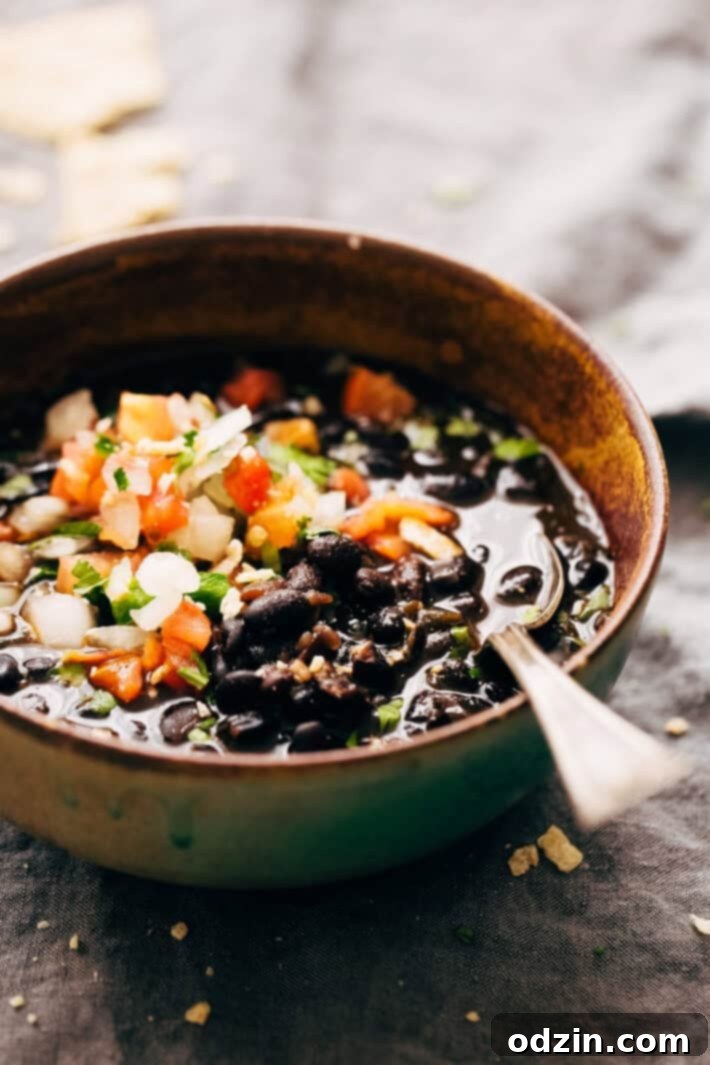 Instant Pot Easy Detoxing Black Bean Soup - a super simple homemade soup made in the pressure cooker! Great for bagged lunches because it's better as it sits! #spicyblackbeansoup #blackbeansoup #detoxsoup #detoxingsoup | Littlespicejar.com Instant Pot Easy Detoxing Black Bean Soup - a super simple homemade soup made in the pressure cooker! Great for bagged lunches because it's better as it sits! #spicyblackbeansoup #blackbeansoup #detoxsoup #detoxingsoup | Littlespicejar.com