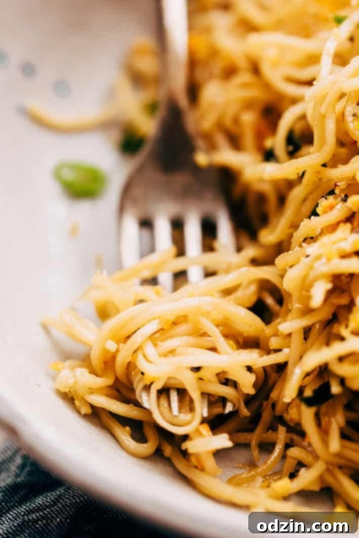 A large pan filled with freshly tossed crazy good quick garlic noodles, ready to be served