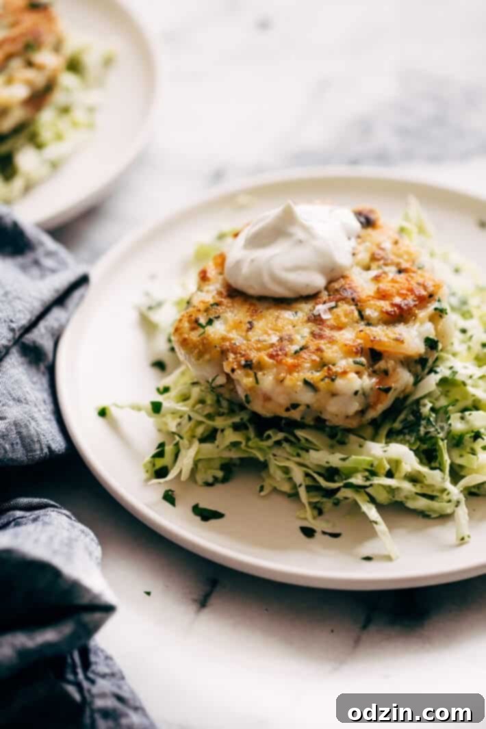 Simple Shrimp Burgers with Jalapeño Lime Slaw - these burgers take in the ballpark of 30 minutes to make. You can serve them on a bed of jalapeño lime slaw or on a brioche bun! Simple, healthy, and delicious! #seafood #shrimp #shrimpburgers #dinner #slaw | Littlespicejar.com Simple Shrimp Burgers with Jalapeño Lime Slaw - these burgers take in the ballpark of 30 minutes to make. You can serve them on a bed of jalapeño lime slaw or on a brioche bun! Simple, healthy, and delicious! #seafood #shrimp #shrimpburgers #dinner #slaw | Littlespicejar.com