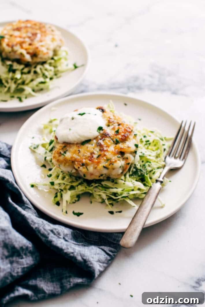 Simple Shrimp Burgers with Jalapeño Lime Slaw - these burgers take in the ballpark of 30 minutes to make. You can serve them on a bed of jalapeño lime slaw or on a brioche bun! Simple, healthy, and delicious! #seafood #shrimp #shrimpburgers #dinner #slaw | Littlespicejar.com Simple Shrimp Burgers with Jalapeño Lime Slaw - these burgers take in the ballpark of 30 minutes to make. You can serve them on a bed of jalapeño lime slaw or on a brioche bun! Simple, healthy, and delicious! #seafood #shrimp #shrimpburgers #dinner #slaw | Littlespicejar.com