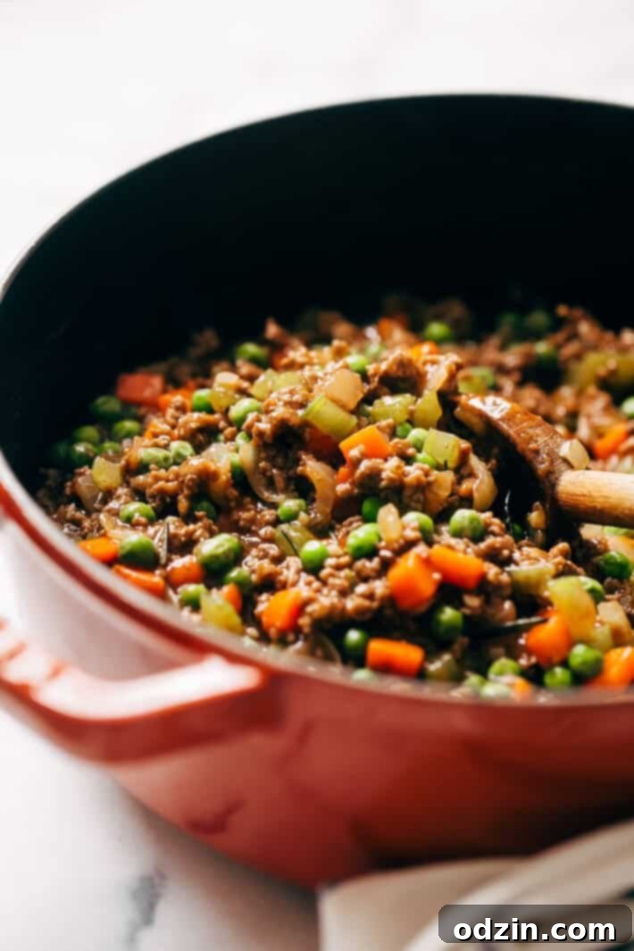 Savory ground beef filling prepared for shepherd's pie, showcasing cooked mirepoix and rich sauce