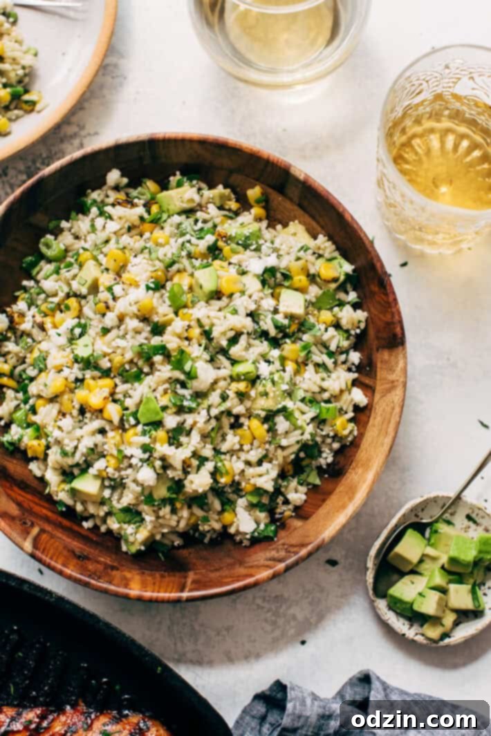 Best Street Corn Rice Salad Recipe Mexican Street Corn Rice Salad with Avocados - a perfect summer side dish for picnics, barbecues, and potlucks. Features roasted corn, fluffy rice, creamy avocado, cotija cheese, and a bright lemon-lime dressing. Easy to make and incredibly flavorful!