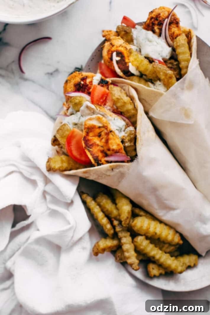 Homemade Chicken Gyros with Crispy French Fries and Creamy Tzatziki Sauce
