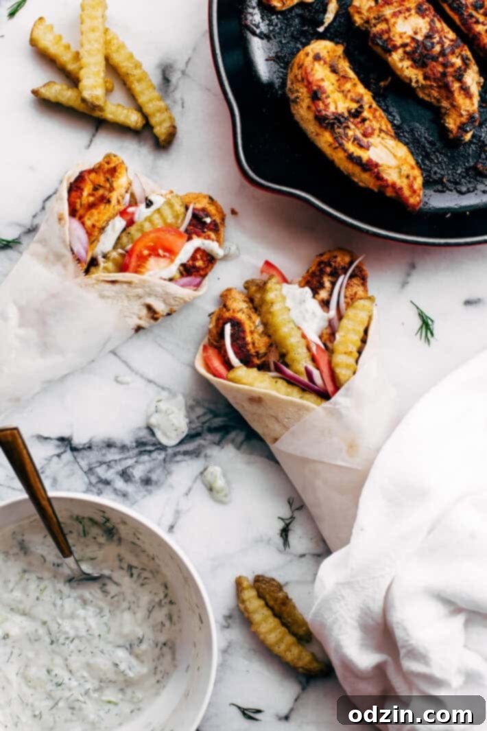 Assembled Chicken Gyros with French Fries and Tzatziki