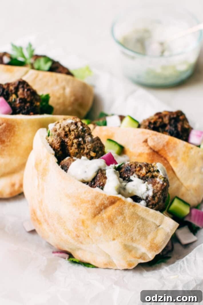Kofta Pita Sandwiches - homemade kofta kabobs made with just a few ingredients and stuffed inside pocket pita bread! These are so good with my homemade garlic tahini sauce! #kofta #koftakabob #koftapitasandwich #naanwich | Littlespicejar.com