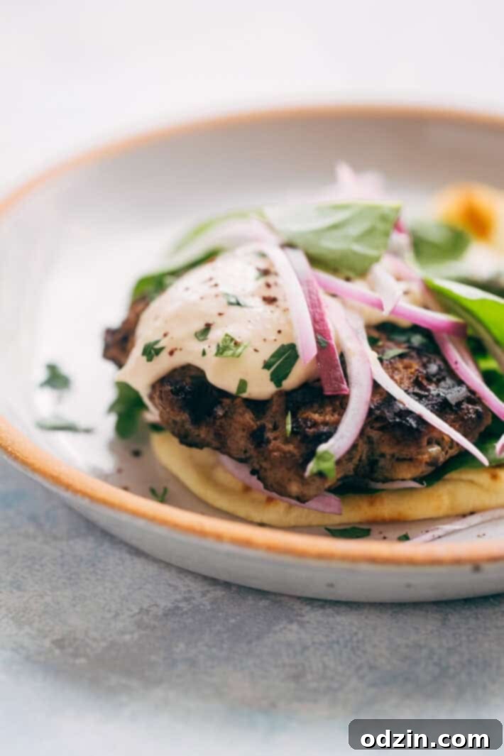 Kofta Pita Sandwiches - homemade kofta kabobs made with just a few ingredients and stuffed inside pocket pita bread! These are so good with my homemade garlic tahini sauce! #kofta #koftakabob #koftapitasandwich #naanwich | Littlespicejar.com