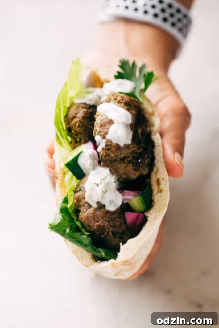 Kofta Pita Sandwiches - homemade kofta kabobs made with just a few ingredients and stuffed inside pocket pita bread! These are so good with my homemade garlic tahini sauce! #kofta #koftakabob #koftapitasandwich #naanwich | Littlespicejar.com
