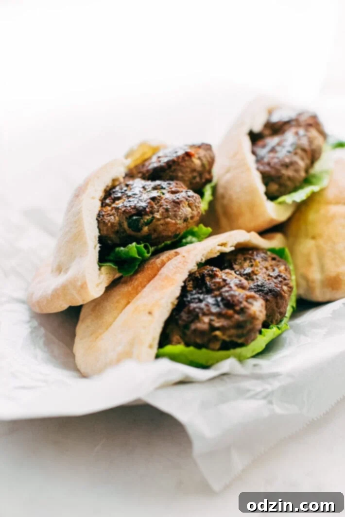 Kofta Pita Sandwiches - homemade kofta kabobs made with just a few ingredients and stuffed inside pocket pita bread! These are so good with my homemade garlic tahini sauce! #kofta #koftakabob #koftapitasandwich #naanwich | Littlespicejar.com