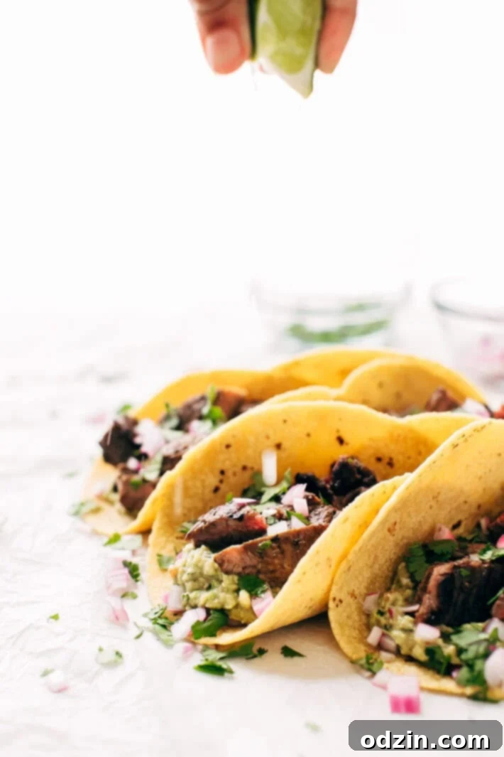 Overhead view of Mojo Steak Tacos with fresh ingredients, ready to be assembled